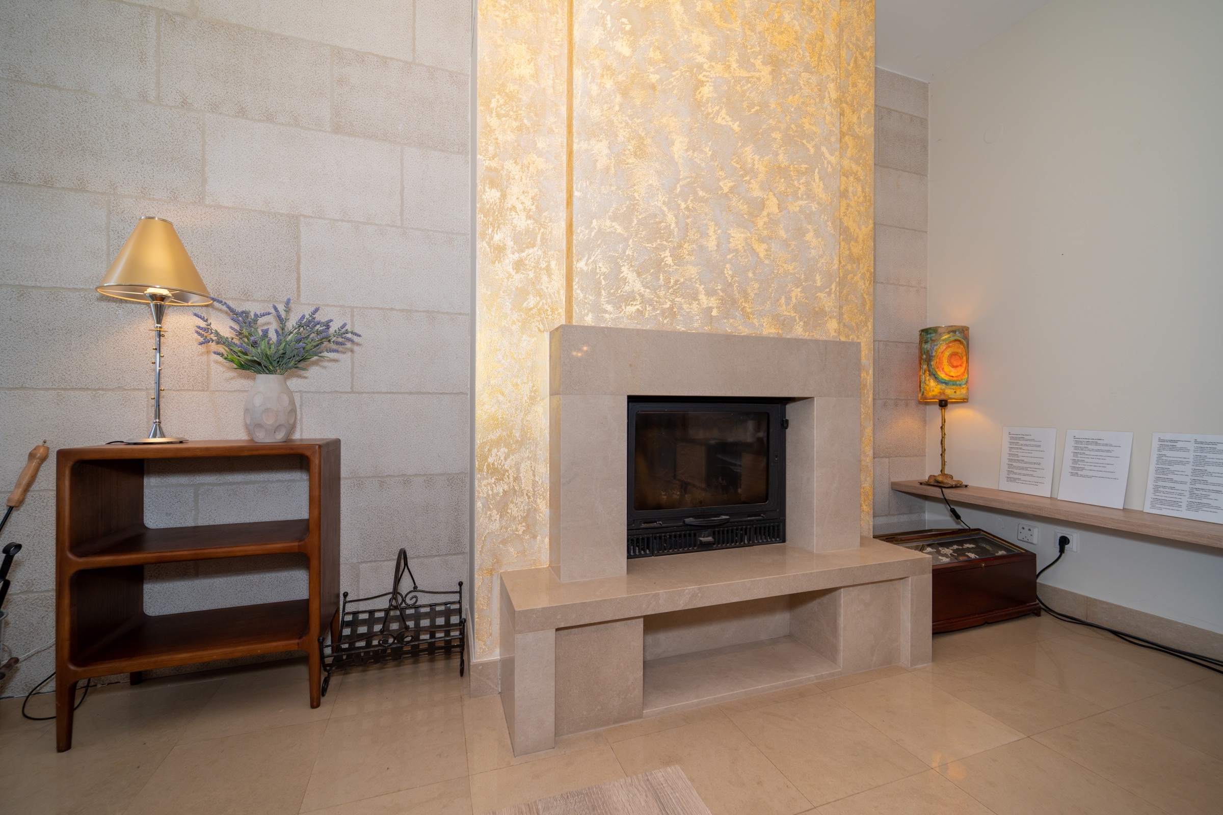 The indoor fireplace beside Villa Lostura’s living room